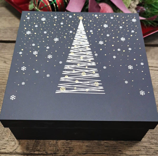 Black Christmas box with white Christmas tree